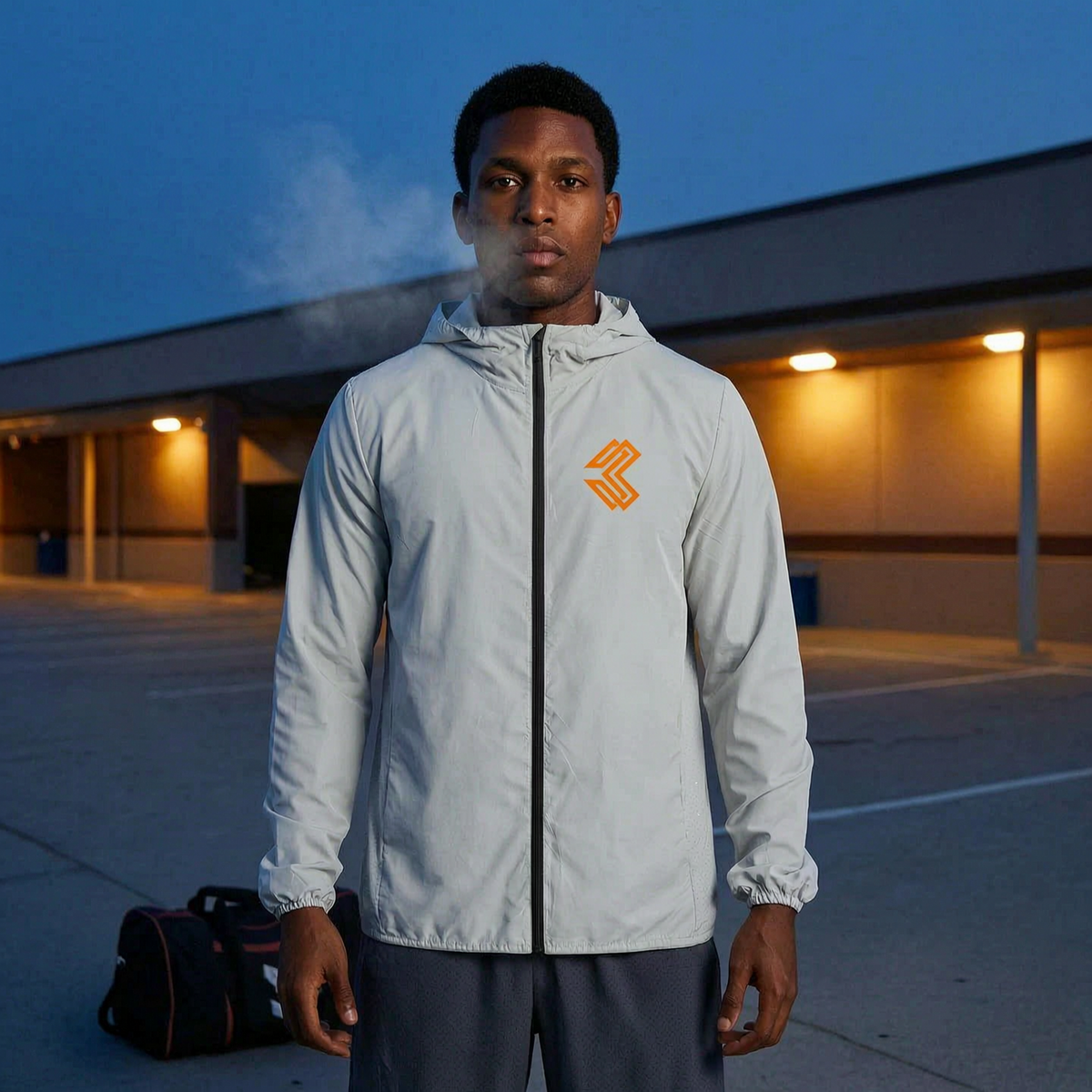Liga Combat Rounds Hooded Jacket worn in a car park at dusk after training, light grey full zip
