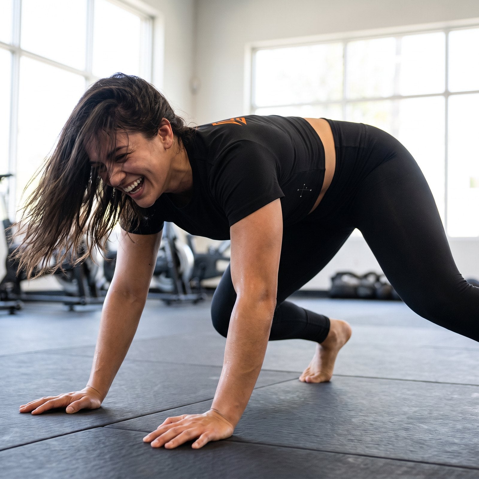 Liga Combat Southern Cross Crop worn dropping into a sprawl on the mats mid-drill
